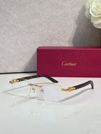 Eyeglasses with clear lenses, gold metal frame, dark green arms and temples
