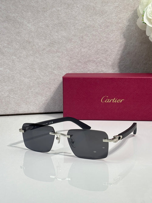 Cartier glasses, black frame with gold-tone arms and dark gray lenses