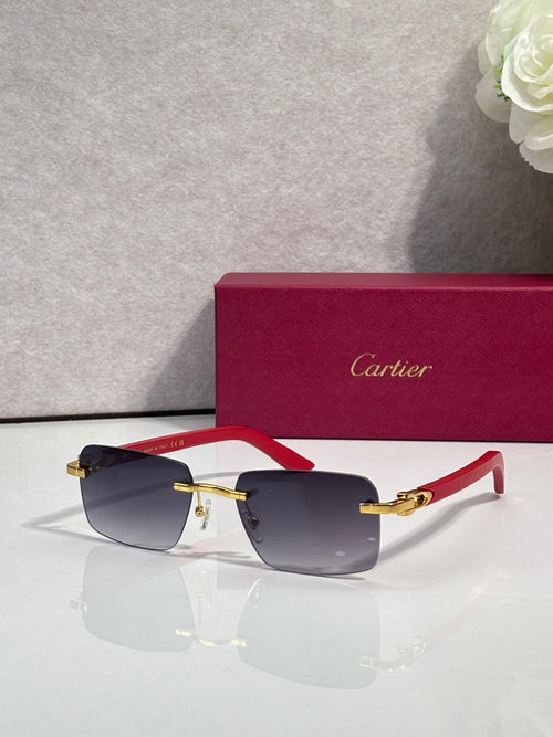 Cartier sunglasses with dark frames, red temple tips, and gold metal accents