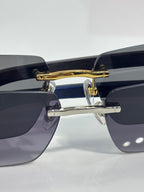Cartier sunglasses front close-up with gold bar hinge and blue gradient lenses