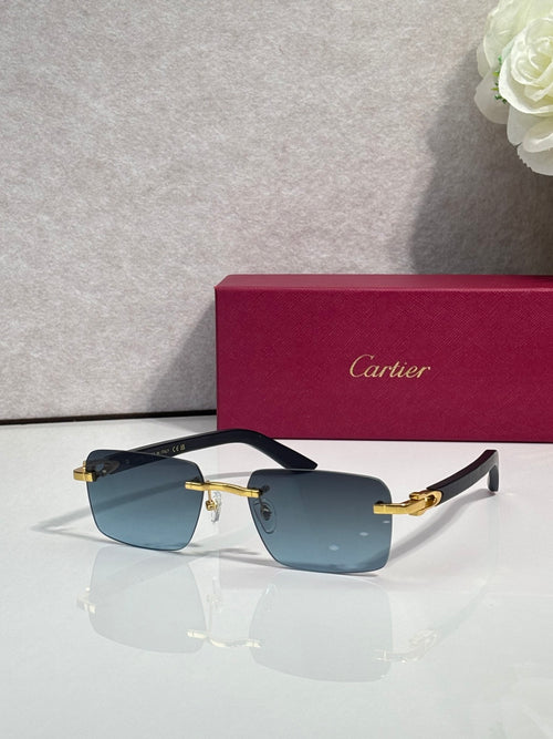 Cartier sunglasses with black frames, blue gradient lenses, and gold metal accents