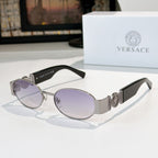 Versace sunglasses: silver frame, light purple-tinted oval lenses, black temples.