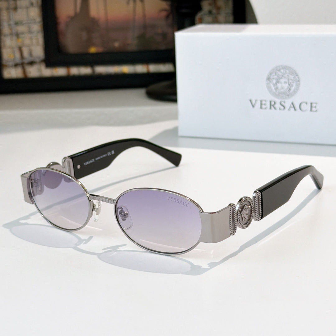 Versace sunglasses: silver frame, light purple-tinted oval lenses, black temples.