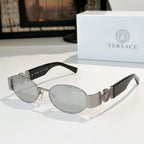 Versace sunglasses: silver frame, gray-tinted oval lenses, patterned temples.