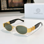 Versace sunglasses: gold frame, dark oval lenses, black temples.