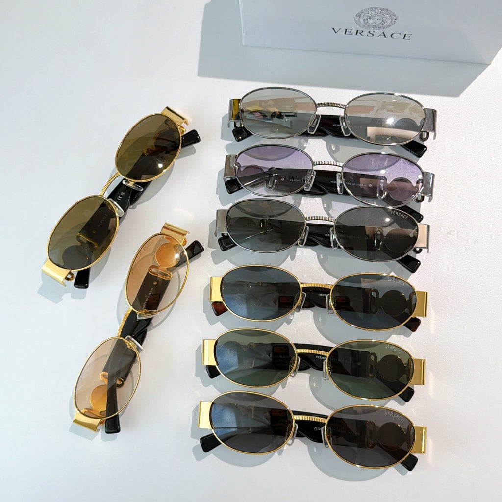 Versace sunglasses assortment with mixed frames and tinted lenses, stacked view.