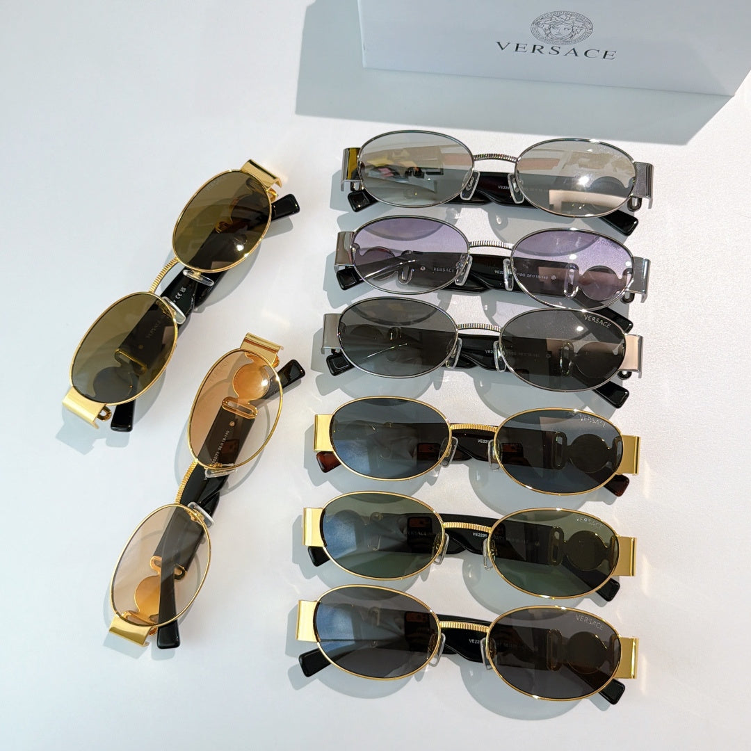 Versace sunglasses assortment with mixed frames and tinted lenses, stacked view.