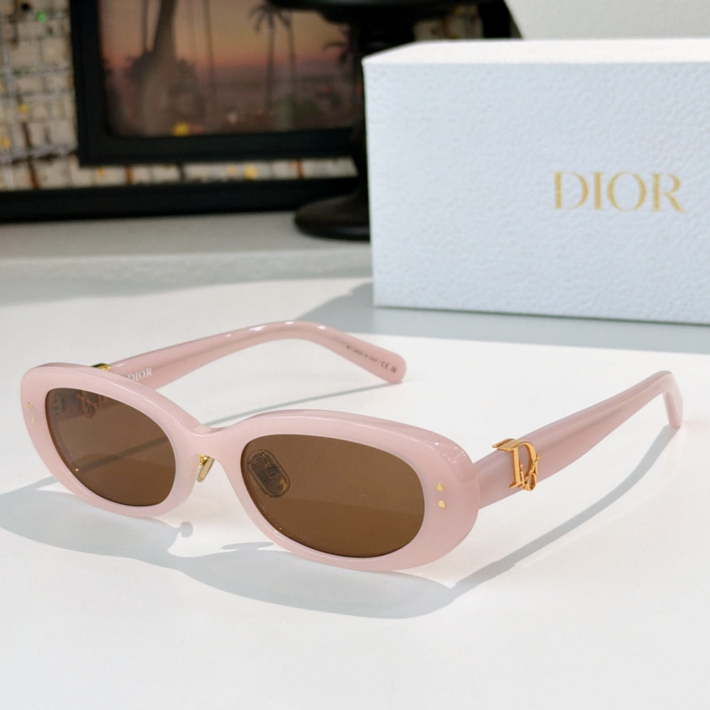 Dior oval sunglasses with light pink frames, brown lenses, and gold D-logo side details