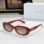 Dior oval sunglasses with red frames, brown lenses, and gold D-logo side accents