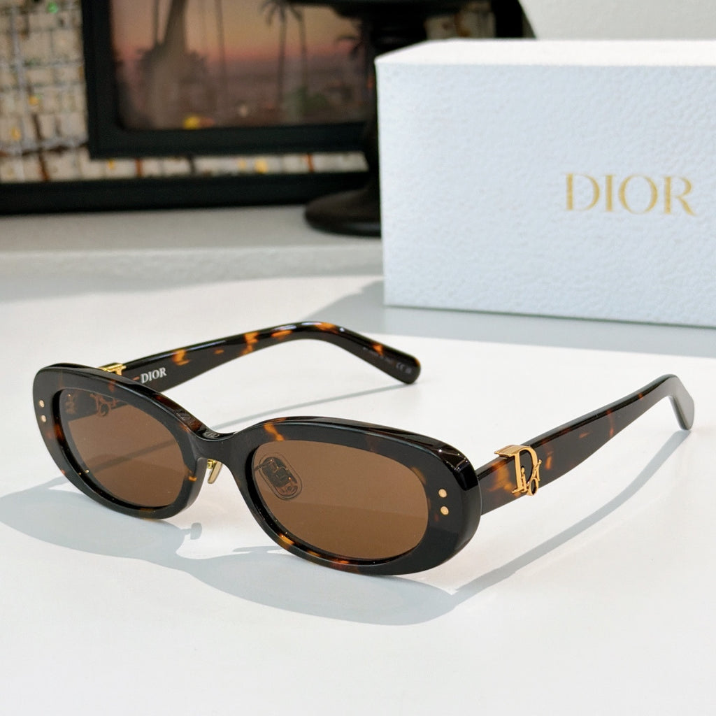 Dior oval sunglasses with tortoiseshell frames, brown lenses, and gold D-logo accents
