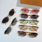 Set of Louis Vuitton sunglasses with gold frames and various colored lenses