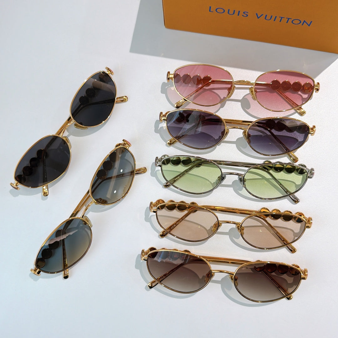Set of Louis Vuitton sunglasses with gold frames and various colored lenses