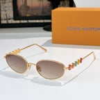 Louis Vuitton sunglasses with gold frame and light rose lenses, colorful bead detail on arm