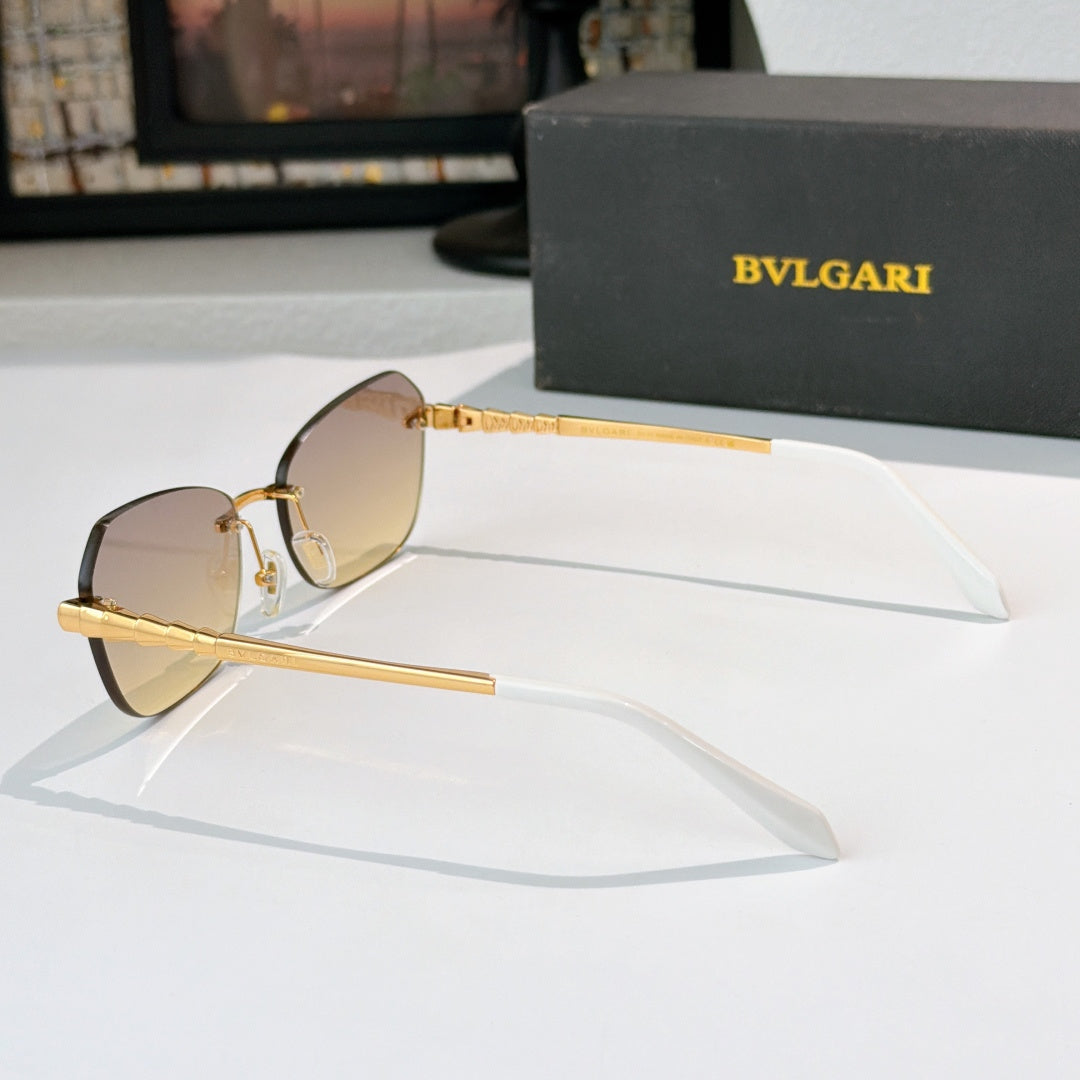Fashion sunglasses with gold-tone frame and mirrored amber lenses, side profile view