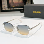 Fashion sunglasses with silver-tone frame and gradient lenses, gold-tone temple accents