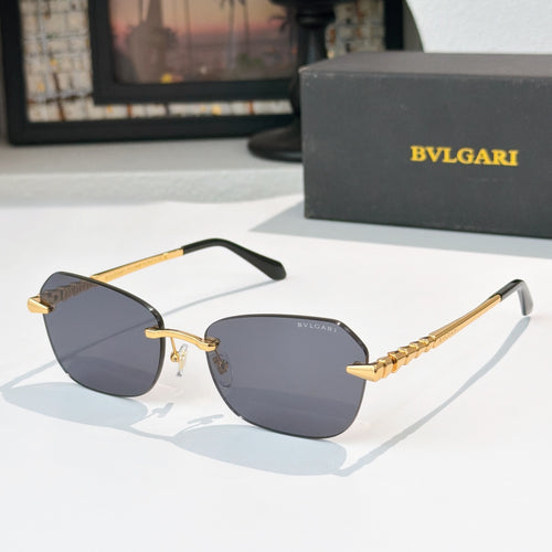 Fashion sunglasses with gold-tone frame and dark purple tinted lenses, side temples detail