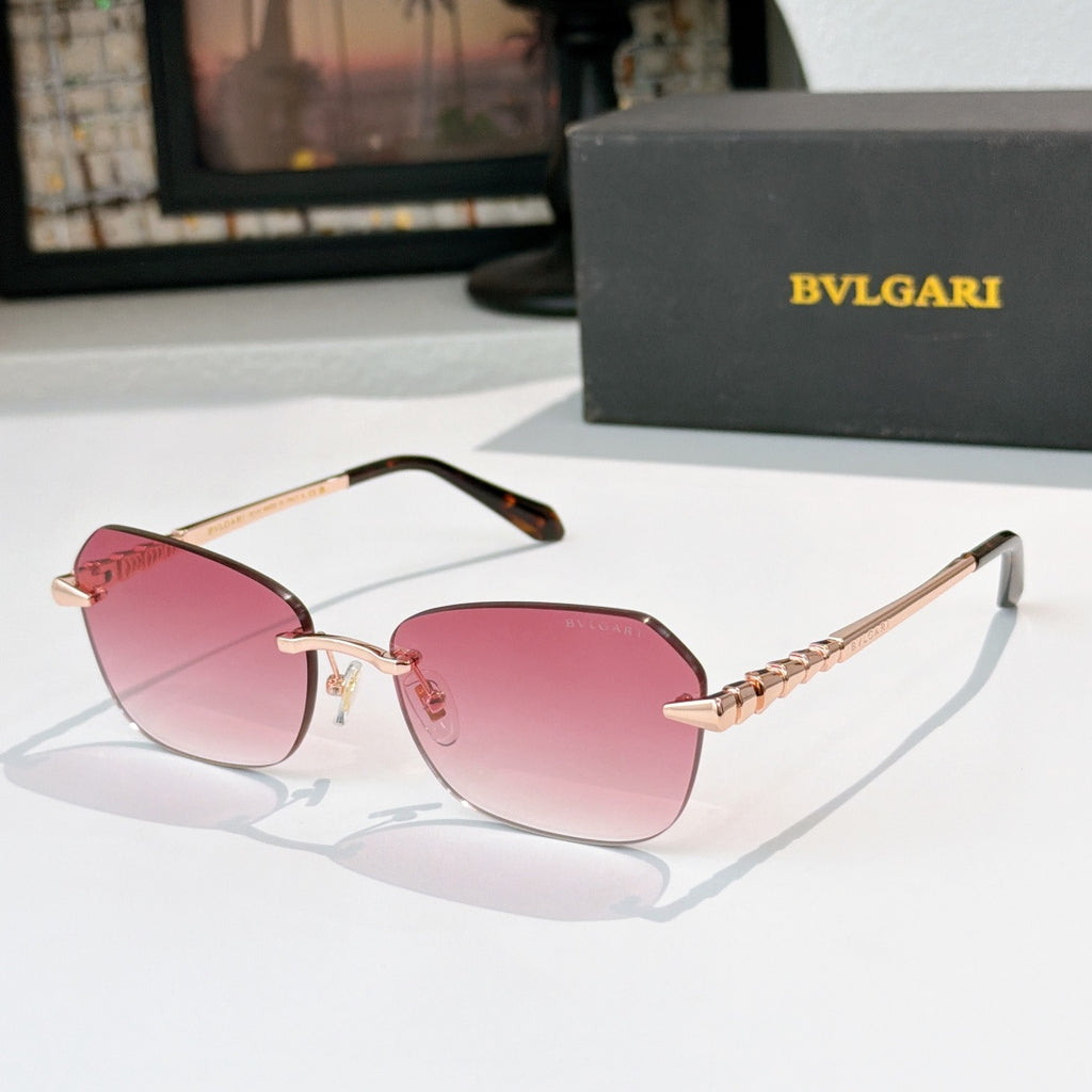 Fashion sunglasses with gold-tone frame and pink tinted lenses, sculpted temple details