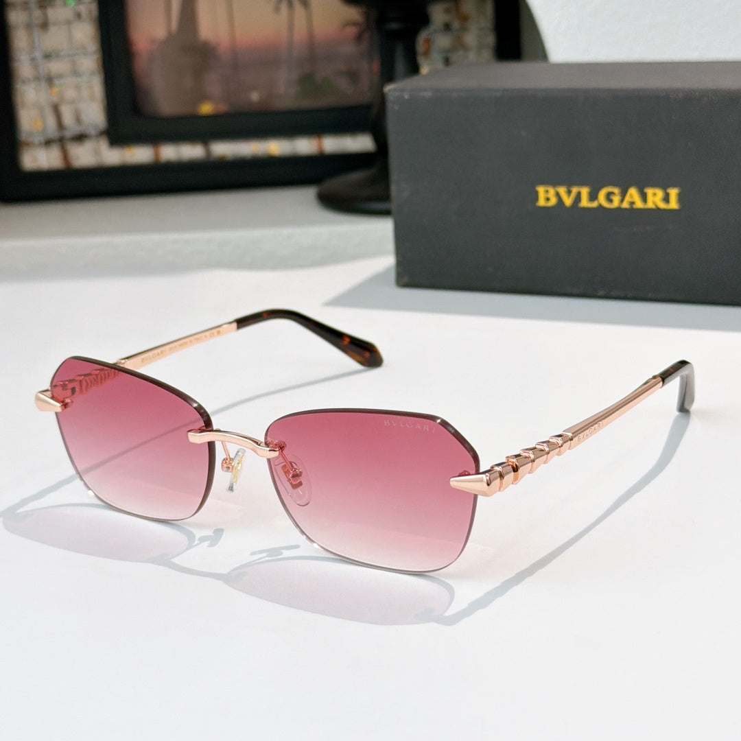Fashion sunglasses with gold-tone frame and pink tinted lenses, sculpted temple details