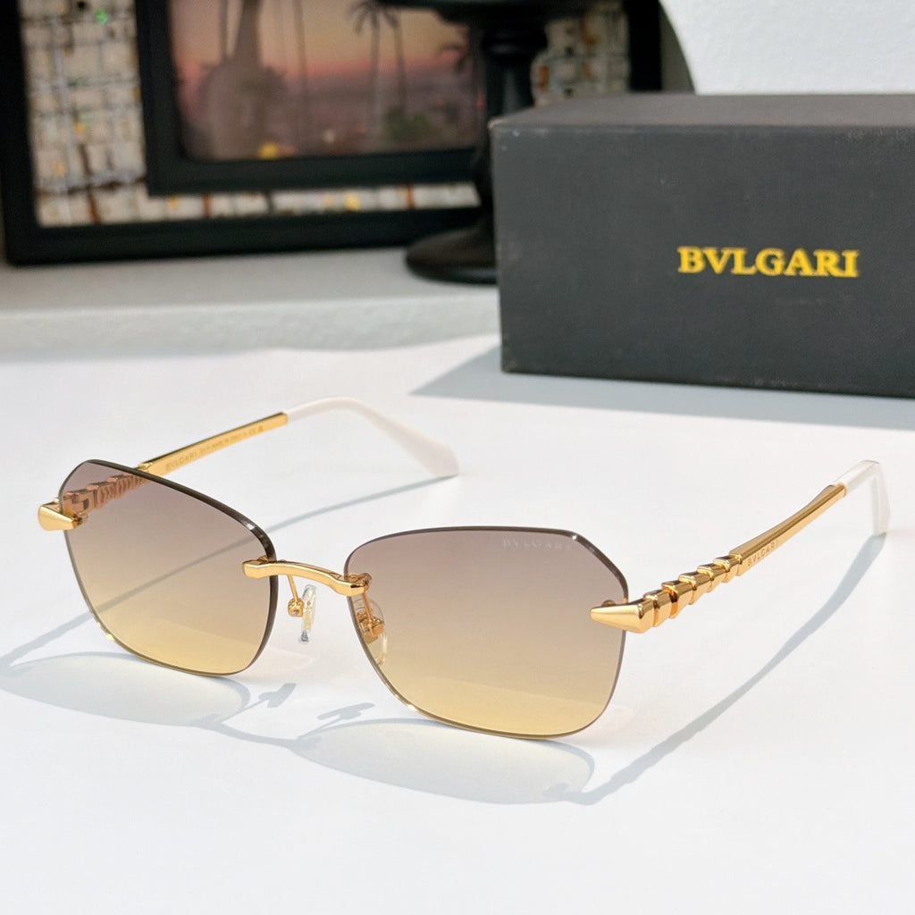 Fashion sunglasses with gold-tone frame and amber tinted lenses, dark lens shading