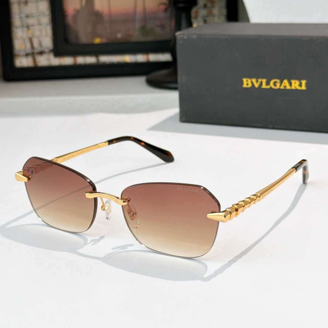 Fashion sunglasses with gold-tone frame and rose tinted gradient lenses, decorative temple links