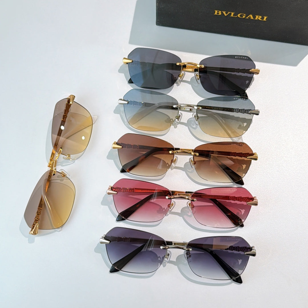 Fashion sunglasses display with mixed dark and tinted lenses, gold-tone frames on top view