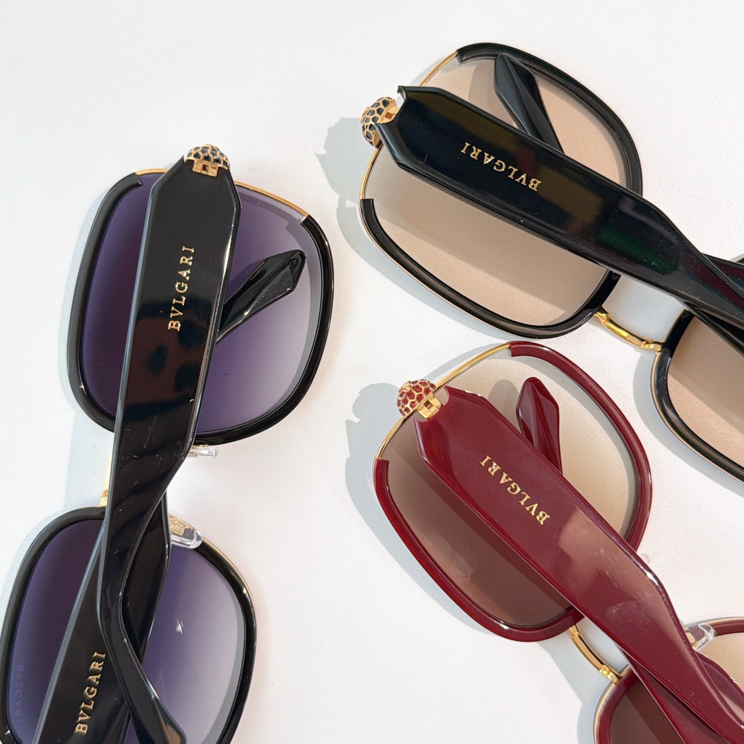 Bvlgari sunglasses set with dark, red, and black frames and tinted lenses