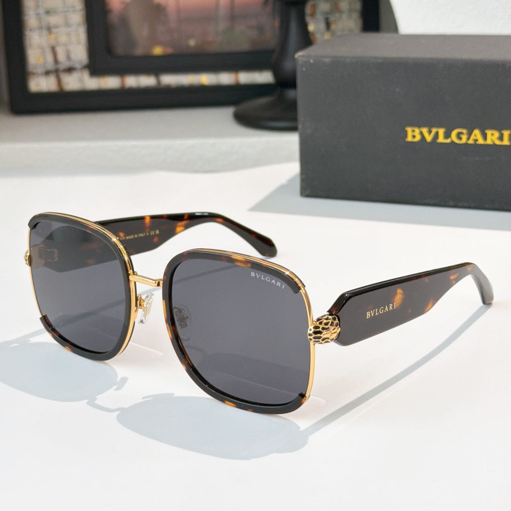 Bvlgari sunglasses with black frames, gold accents, and dark tinted lenses
