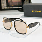 Bvlgari sunglasses with black frames, gold accents, and beige tinted lenses