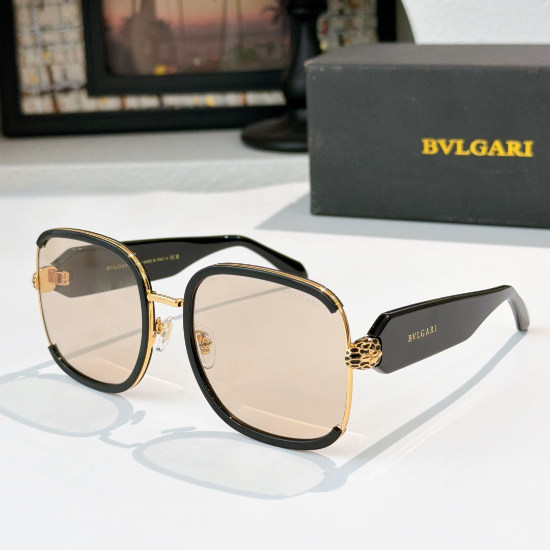 Bvlgari sunglasses with black frames, gold accents, and beige tinted lenses