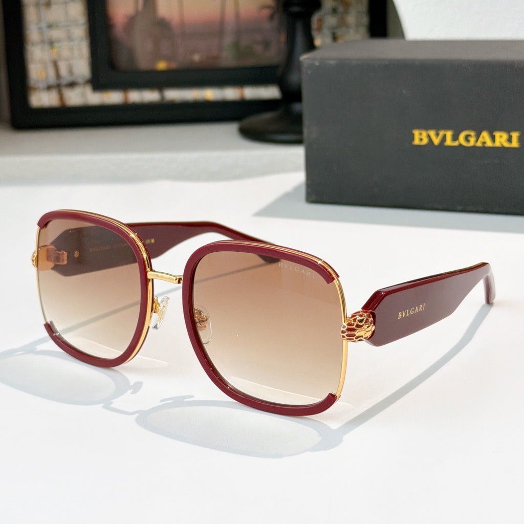 Bvlgari sunglasses with red frames, gold accents, and light tinted lenses