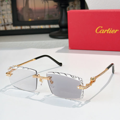 Gold metal sunglasses with geometric temple details and clear gray gradient lenses