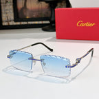 Gold sunglasses with black temples and light blue gradient lenses