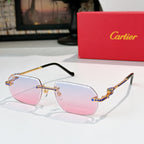 Cartier glasses with gold-tone rims, pink-tinted lenses, and patterned temple arms.