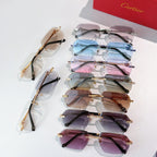 Set of Cartier glasses with gold-tone frames and multi-color tinted lenses.