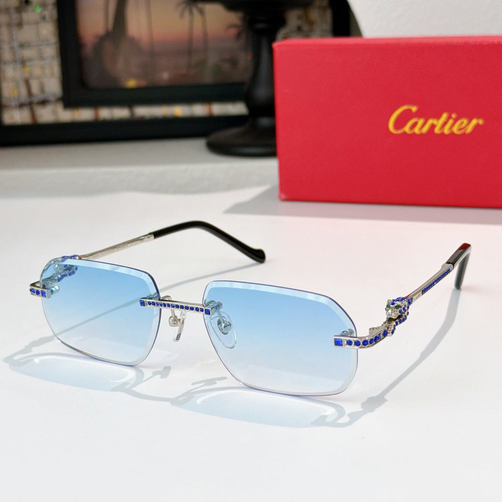 Cartier glasses with gold-tone rims, blue lenses, and patterned temple arms.