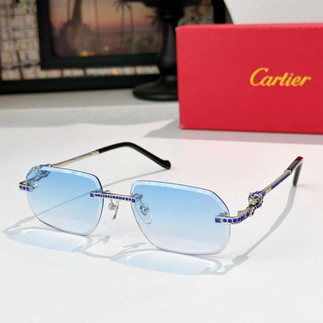 Cartier glasses with gold-tone rims, blue lenses, and patterned temple arms.