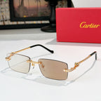Cartier glasses with gold accents, brown-tinted lenses, rectangular frame and jeweled temples