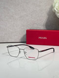 Black eyeglasses with clear lenses and red logo accent on the temple