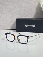 Chrome glasses with dark blue frames, red accents, and clear lenses