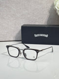 Chrome glasses with black rectangular frames and clear lenses