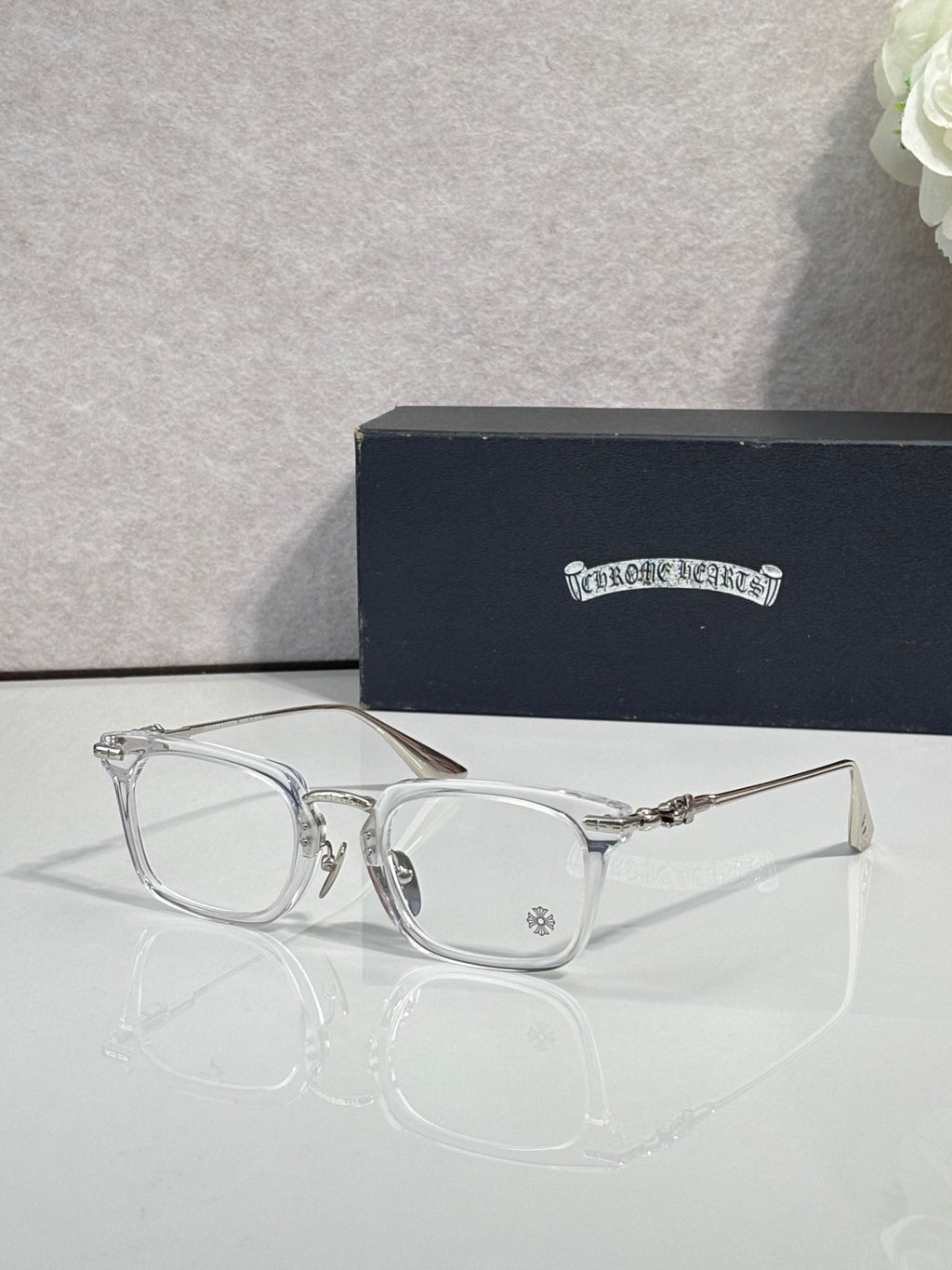 Chrome glasses with clear rectangular frames and clear lenses
