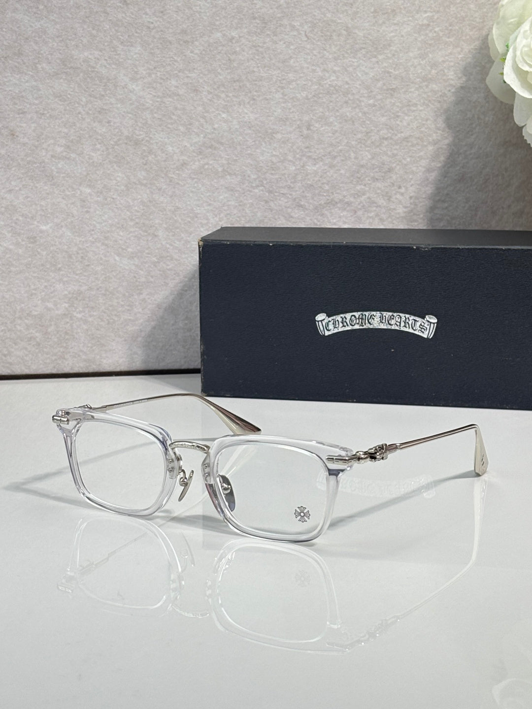 Chrome glasses with clear rectangular frames and clear lenses