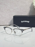 Eyeglasses with dark tortoise frame, clear lenses, gold arms with star detail