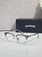 Eyeglasses with dark tortoise frame, clear lenses, gold arms with star detail