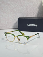 Eyeglasses with green frame, clear lenses, gold temple arms with star motif