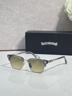 Cat-eye glasses with silver frame, gold arms, and light-tinted lenses