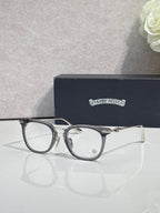 Chrome eyeglasses with dark blue round frames and clear lenses