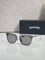 Chrome sunglasses with dark navy frames, silver-tone arms, and tinted lenses