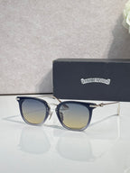 Chrome sunglasses with dark navy frames, gold-tone details, and tinted lenses