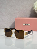Gold square sunglasses with dark gradient lenses, on display with logo temples